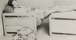 1986 Student Asleep in Furniture by Evans Library